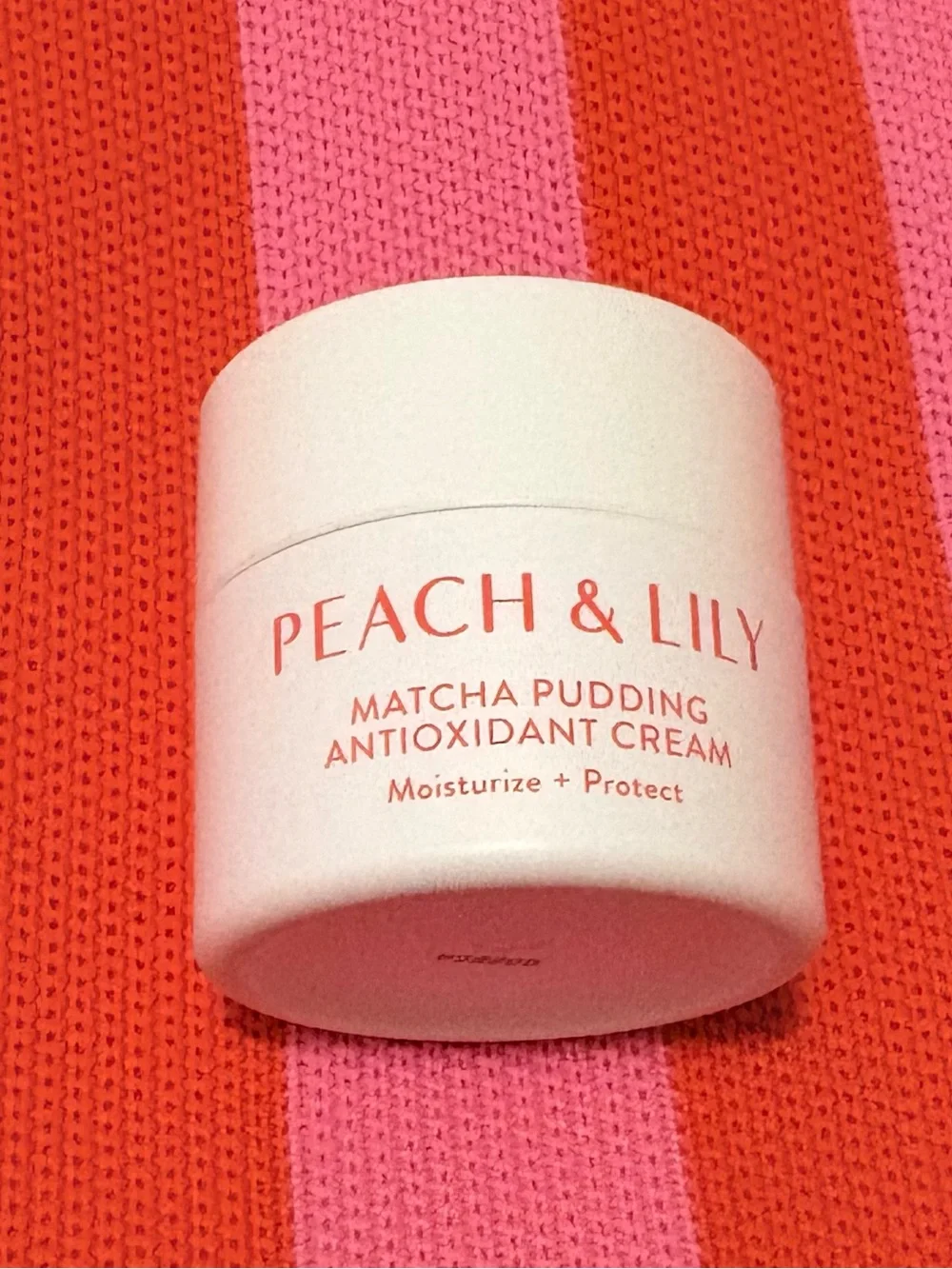Peach & Lily Matcha Pudding Antioxidant Cream - White Jar with Coral Text